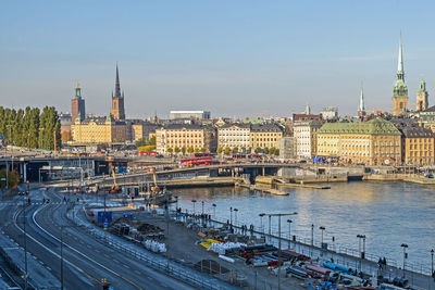 High angle view of bridge over river against buildings