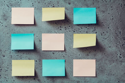 Close-up of sticky notes on wall