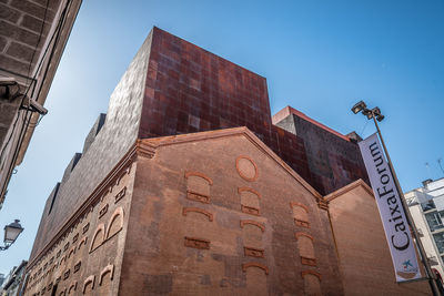 Low angle view of buildings against clear sky