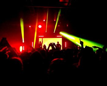 Rear view of people enjoying music concert