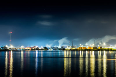 Illuminated city at waterfront