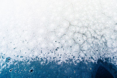 Full frame shot of wet window during winter