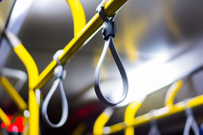 Close-up of yellow cables against blurred background