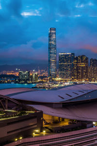 Illuminated modern buildings in city at night