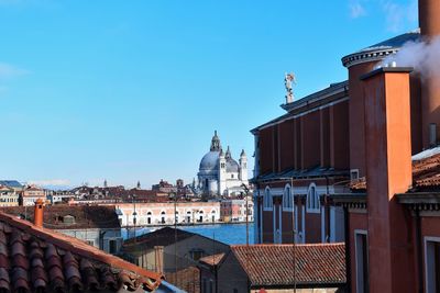 View of cityscape against blue sky