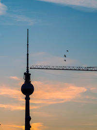 Low angle view of silhouette birds against sky during sunset