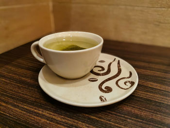 Close-up of tea cup on table