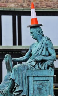 Low angle view of statue against sky