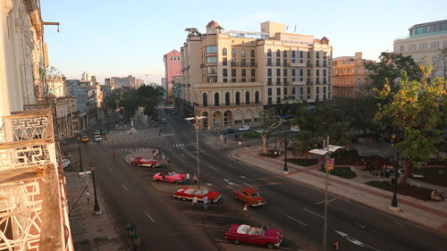 High angle view of traffic on road amidst buildings in city