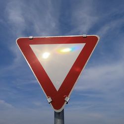 A give way or yield traffic sign on the street