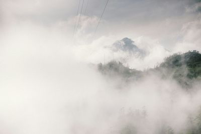 Scenic view of tree mountains against sky