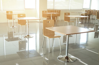 Empty chairs and table in restaurant