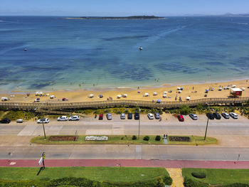 High angle view of beach by sea against sky