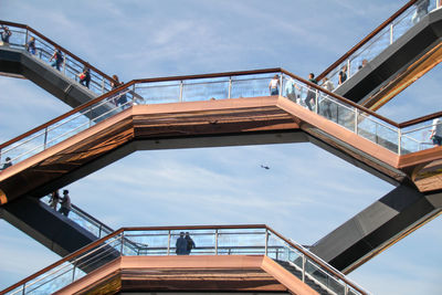 Low angle view of bridge against sky in city