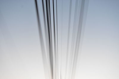 Low angle view of glass against clear sky