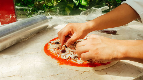 Cropped image of man washing hands