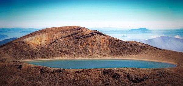 Scenic view of mountain against blue sky