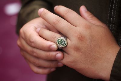 Midsection of woman wearing ring