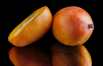 Close-up of fruits against black background