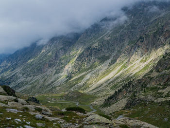 View of countryside landscape against cloudy sky