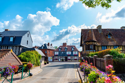 Street amidst houses and buildings in town