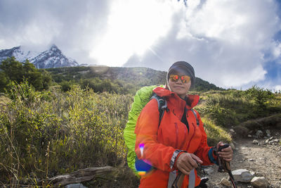 Female hiker on the way up to torres del paine national park