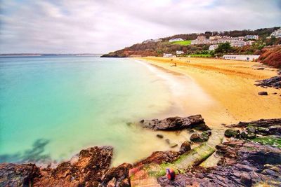 Scenic view of sea against cloudy sky