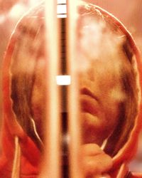 Close-up portrait of man with reflection