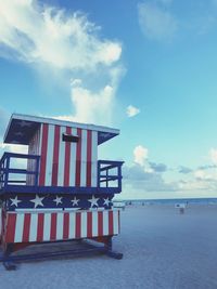 Built structure on beach against sky