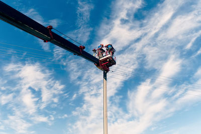 Low angle view of street light against sky