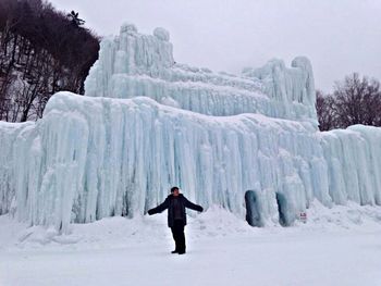 Man standing on snow covered mountain