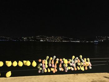 Text on beach against clear sky at night