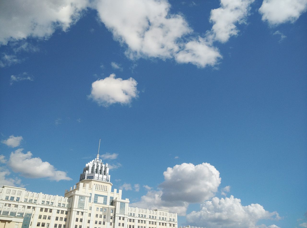 architecture, building exterior, built structure, low angle view, sky, blue, cloud - sky, place of worship, religion, famous place, spirituality, church, cloud, high section, travel destinations, dome, tower, day, city