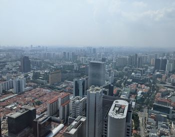 High angle view of city buildings against sky