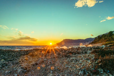 Scenic view of sea against sky during sunset