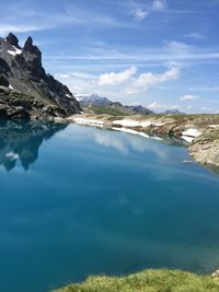 Scenic view of lake against blue sky