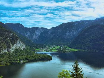 Scenic view of lake and mountains against sky