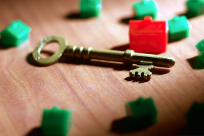 Close-up of key by model homes on table