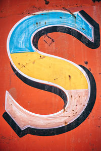 Close-up of yellow arrow symbol