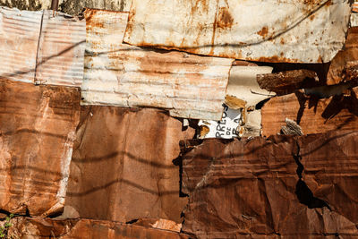 Wall made of old rusty steel sheets