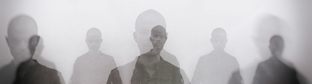 Multiple image of man against white background
