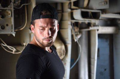 Portrait of man standing in factory