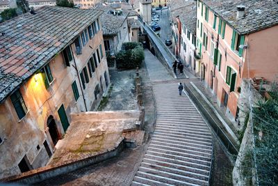 High angle view of street amidst buildings in town