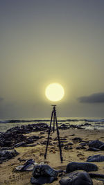 Abandoned camera tripod on beach