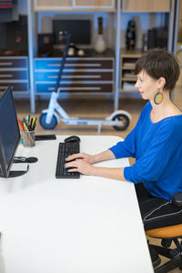 Businesswoman using laptop at office