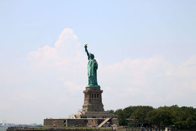 Low angle view of statue against sky