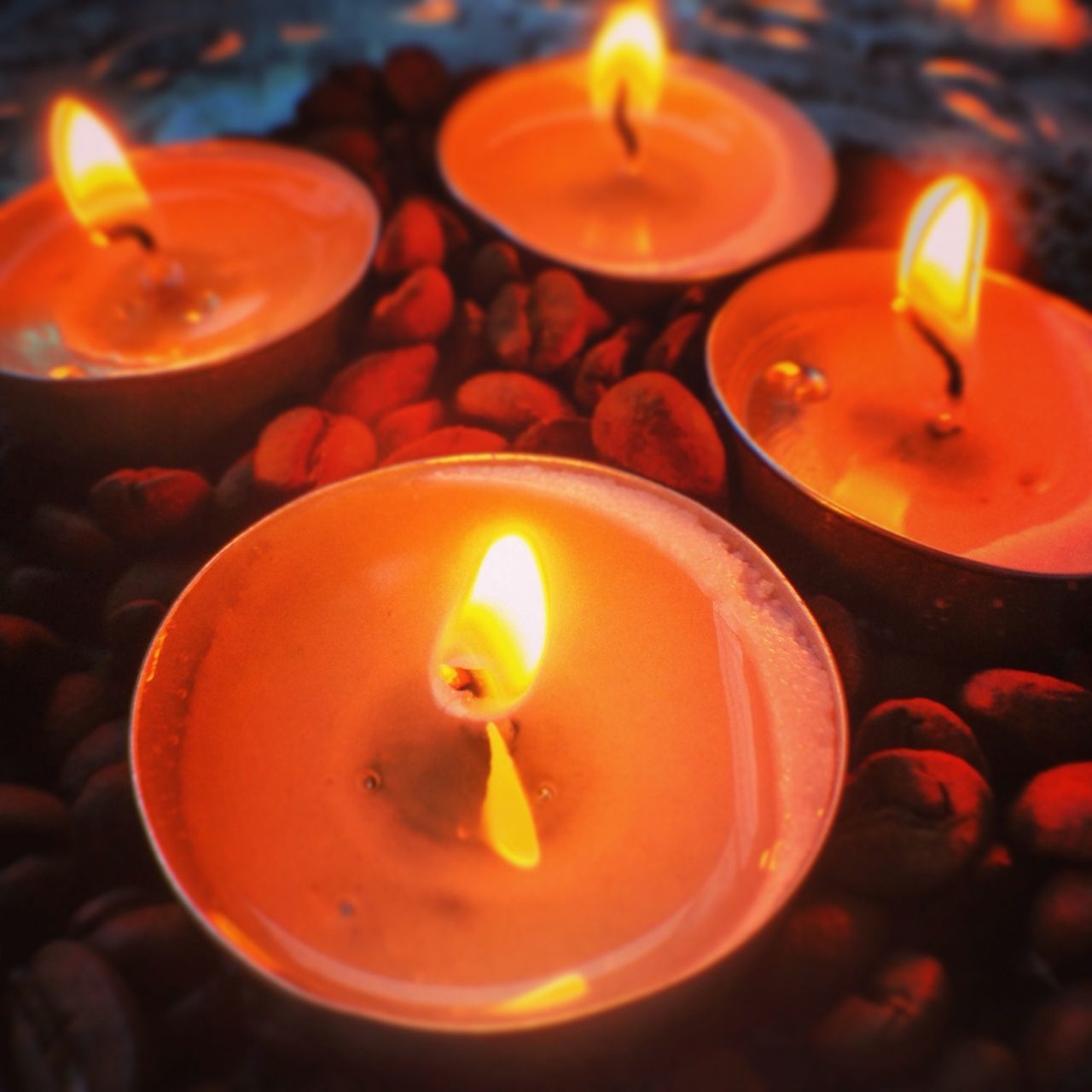 burning, flame, candle, glowing, fire - natural phenomenon, heat - temperature, illuminated, lit, indoors, candlelight, close-up, tea light, fire, night, orange color, celebration, lighting equipment, light - natural phenomenon, wax, focus on foreground