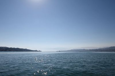 Scenic view of calm sea against clear sky