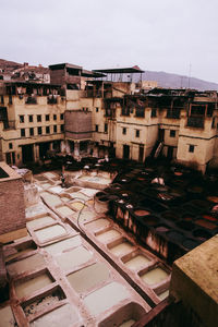 High angle view of buildings in city against sky