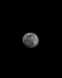 Low angle view of moon against sky at night